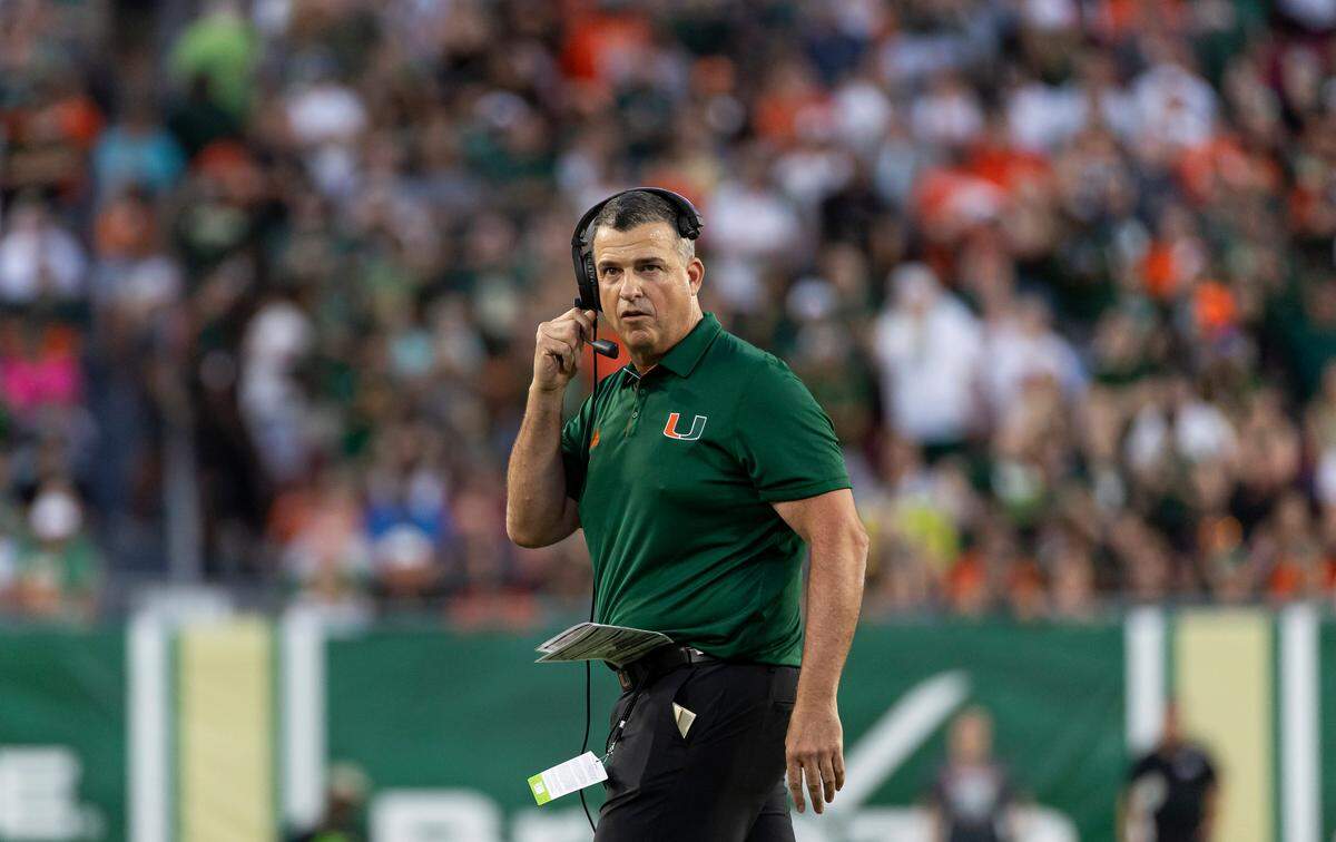 Miami Hurricanes head coach Mario Cristobal looks on after talking with referees in the first half of his NCAA college football game against the South Florida Bulls at the Raymond James Stadium on Saturday, Sept. 21, 2024, in Tampa, Fla.