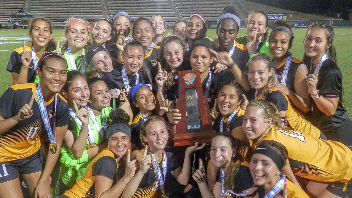 The Plantation American Heritage girls’ soccer team celebrates after winning the Class 3A state championship on Friday, Feb. 22, 2019, in DeLand, Florida
