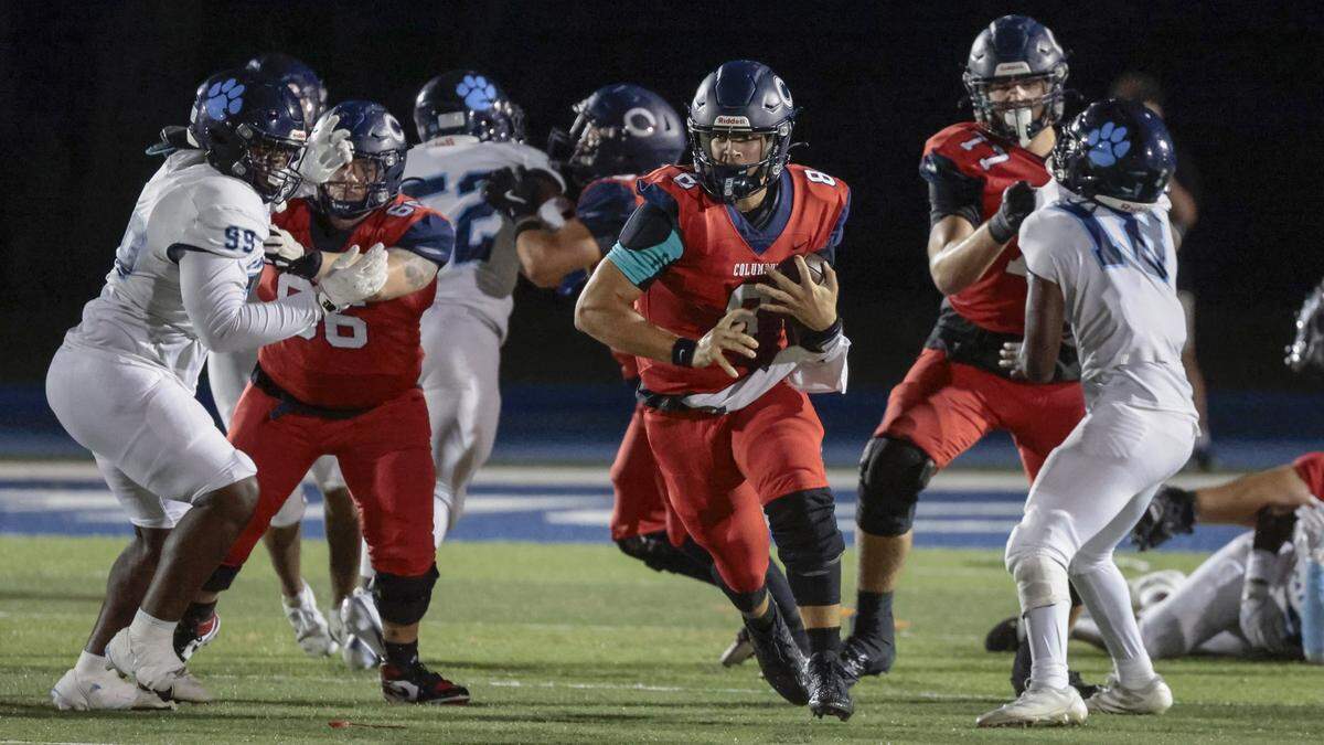 Columbus Explorer High's quarterback Kingston Rust (8) scrambles on an 38 yard run against Miami Palmetto High in the first half at Tropical Park in Miami, Florida on Friday, September 12, 2025.