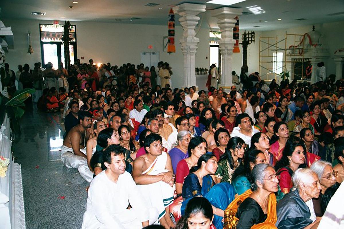 Devotees sit inside Shiva Vishnu Temple of South Florida on the day the Temple was consecrated in 2001. The traditional South Indian Hindu temple is located in Southwest Ranches in Broward County.