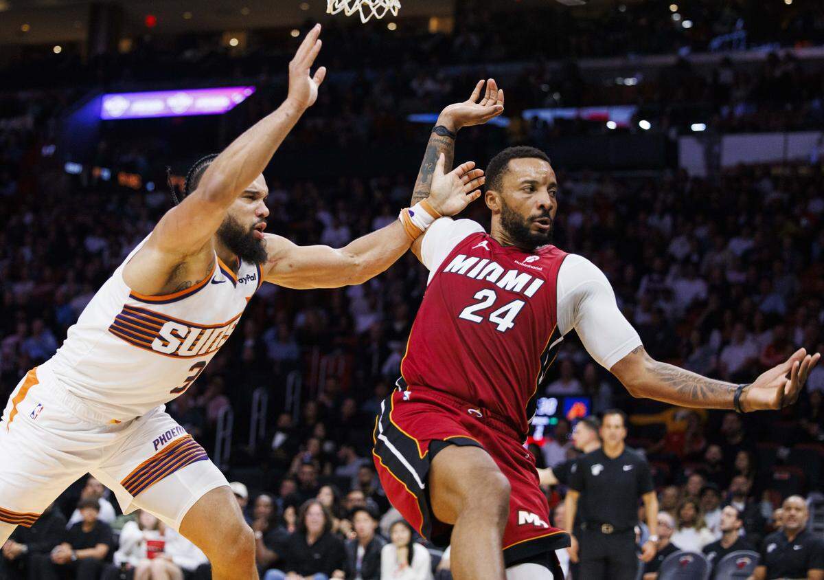 Phoenix Suns forward Dillon Brooks (3) pushes Miami Heat guard Norman Powell (24) and receives a technical foul during the second half of a game on Tuesday, Jan. 13, 2026, at the Kaseya Center in downtown Miami, Fla. 