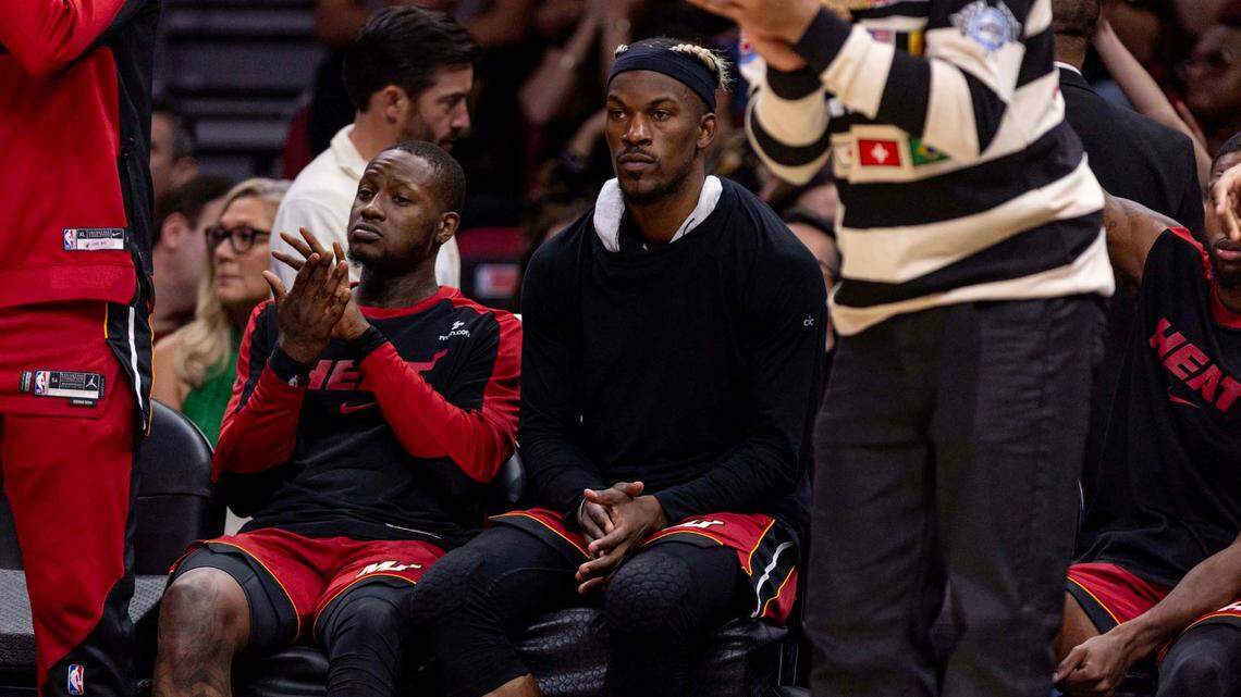 Miami Heat forward Jimmy Butler (22) sits on the bench motionless as teammates celebrate around him during the second half of an NBA game against the Portland Trail Blazers at Kaseya Center on January 21, 2025, in Miami.