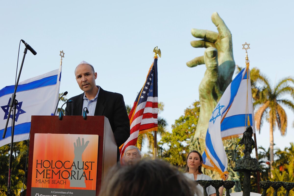 Danny Pelz, a member of the Holocaust Memorial Miami Beach Committe and grandson of a Holocuast survior, speaks during the annual Holocaust remembrance Day held Sunday, April 28, 2019, at the Holocaust Memorial in Miami Beach. Hundred of Miami residents of all ages gathered to commemorate six million Holocaust victims.