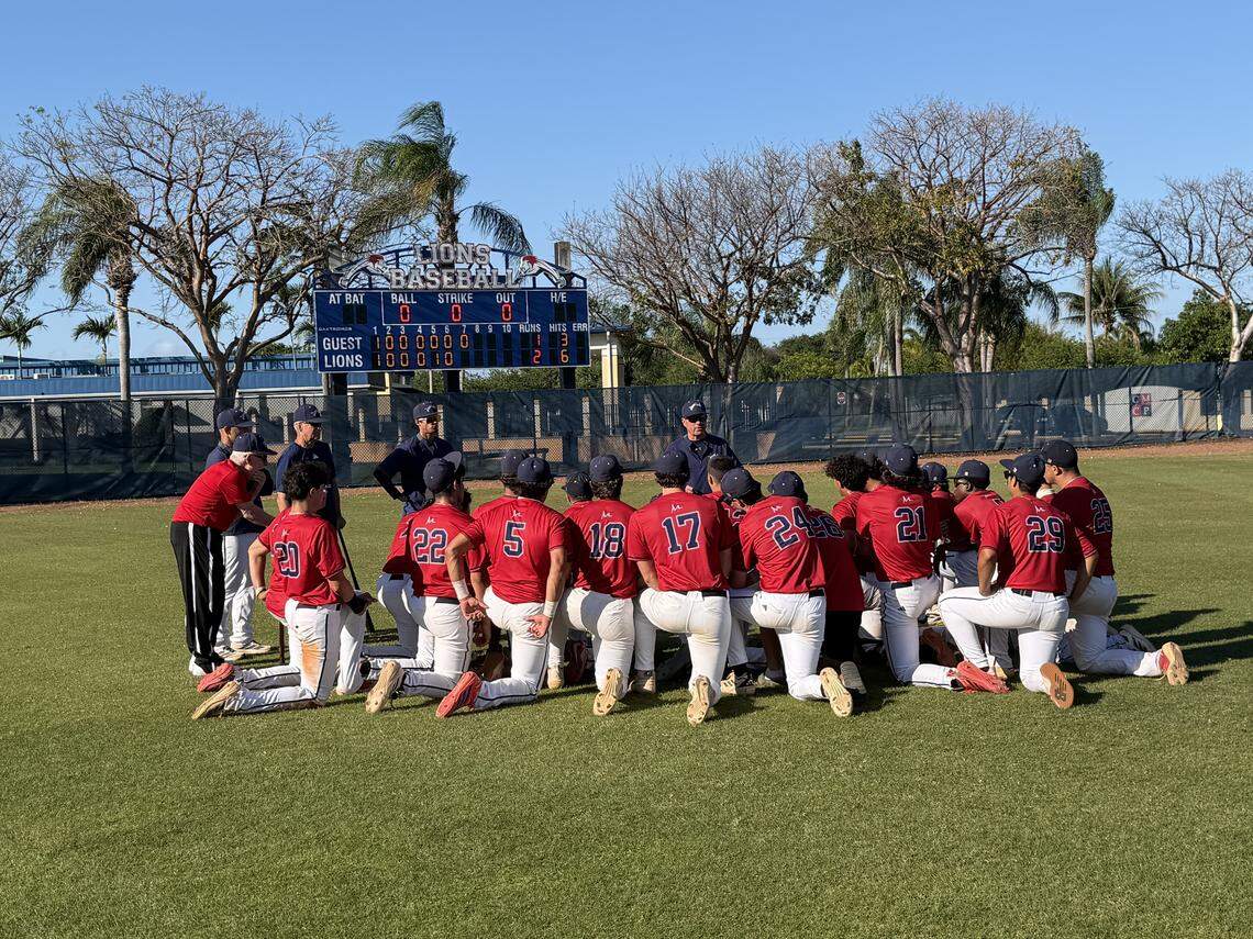 The Chaminade-Madonna baseball team gathers postgame after winning its Region 4-2A quarterfinal baseball game against NSU University School.