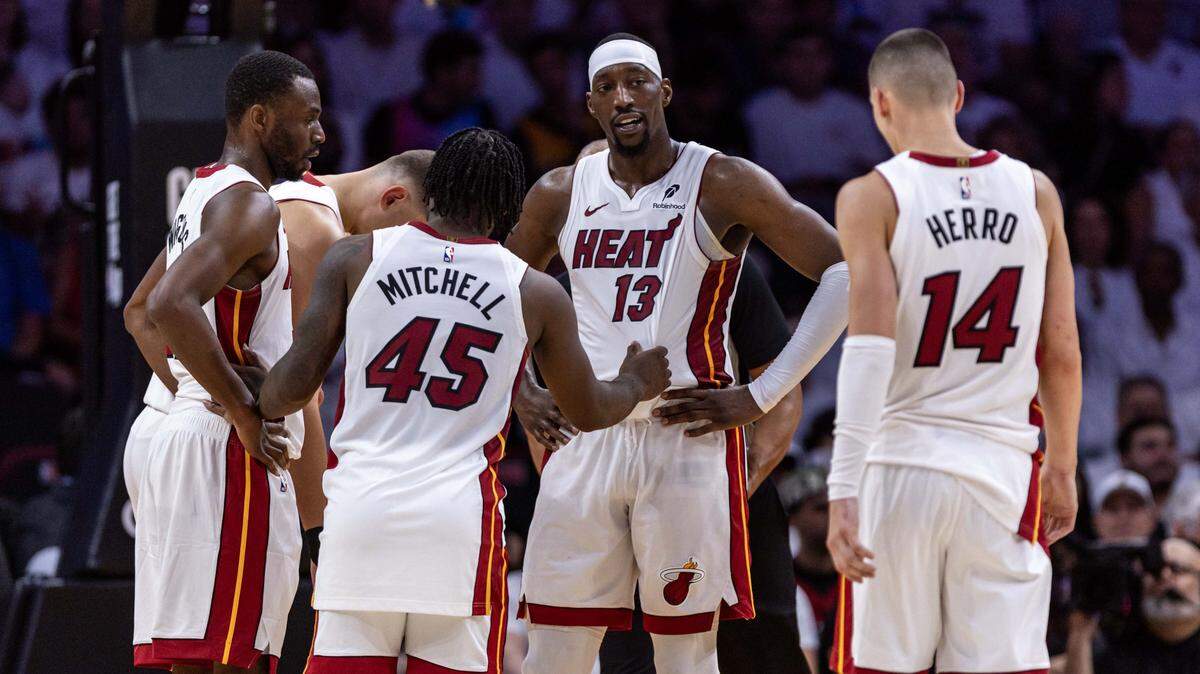 Miami Heat players react on the court while huddling up during the first half of Game 3 of the NBA Playoffs against the Cleveland Cavaliers at Kaseya Center on April 26, 2025, in Miami.