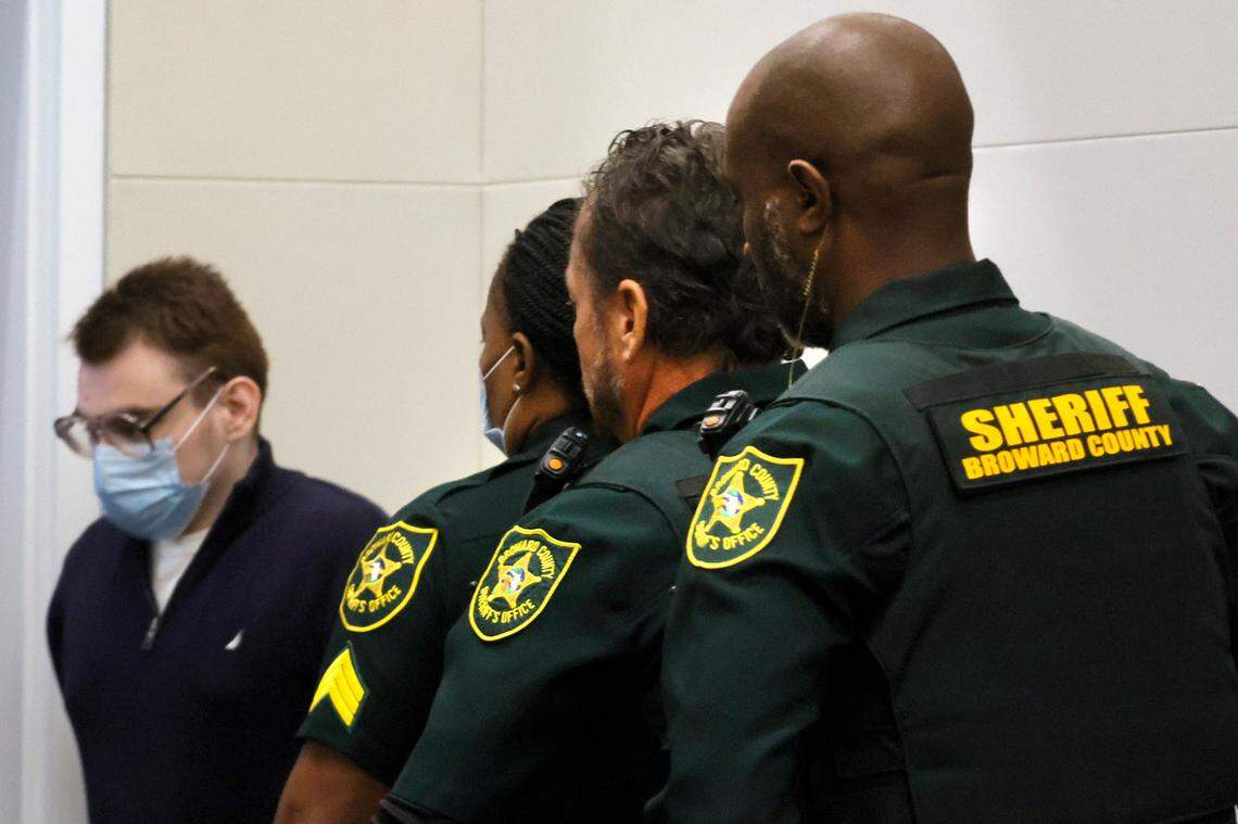 Nikolas Cruz is escorted out of the courtroom by Broward County Sheriff officers.