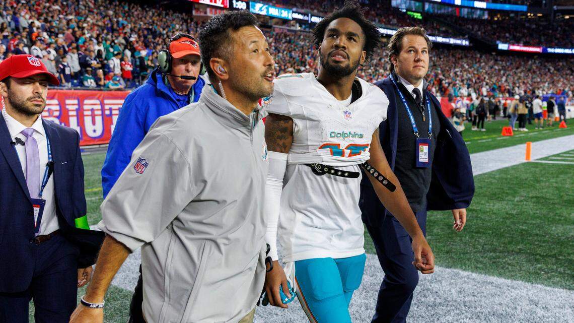 Miami Dolphins wide receiver Jaylen Waddle (17) walk out the field with the medical team after he got injured in a play against the New England Patriots during fourth quarter of an NFL football game at Gillette Stadium on Sunday, Sept. 17, 2023 in Foxborough, MA.