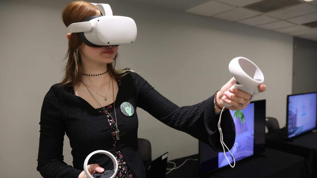 Industrial design student Rebecca Warga does a virtual reality demonstration during the 2023 Women Designing the Future Conference at the New Jersey Institute of Technology.