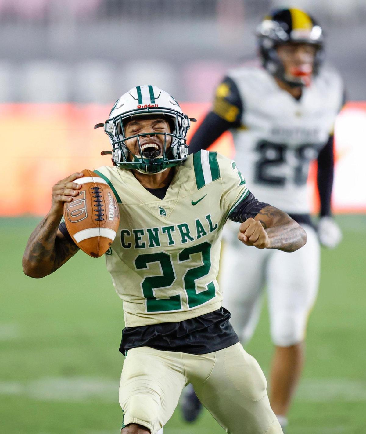 Miami Central’s running back Jonathan Harris (22) reacts after earning a first down in the first quarter against American Heritage during the 2022 FHSAA State Championships-Class 2M at DRV PNK Stadium in Ft. Lauderdale on Friday, December 16, 2022.