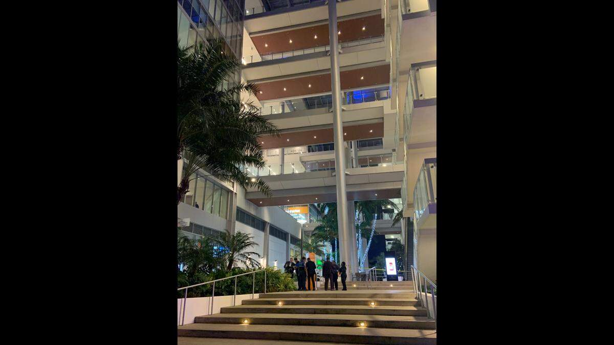 Miami police detectives and crime scene personnel at River Landing Shops & Residences Tuesday around 6 p.m., after a man jumped to his death from one of the walkways above them.