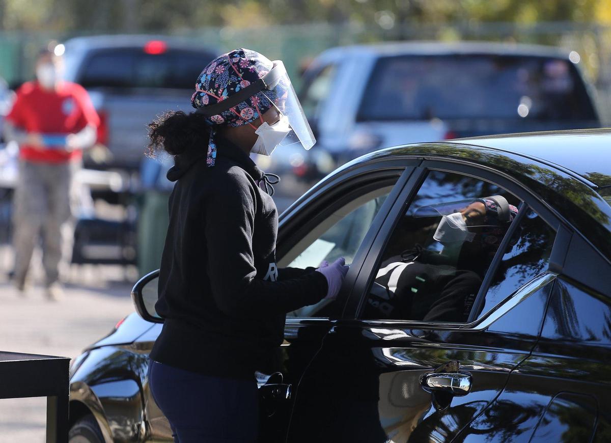 Healthcare workers vaccinate motorists on Sunday, January 10, 2021 as the Florida Division of Emergency Management, in partnership with Senator Shevrin Jones, hosted a COVID-19 vaccination event for seniors 65 and older to increase immunity and protect the health of South Florida’s most vulnerable residents at the Koinopnia Worship Center and Village in Pembroke Park, Florida.