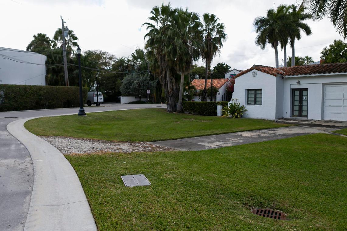 A driveway slopes toward a road that the City of Miami Beach raised as part of the Palm and Hibiscus Islands resiliency project on Tuesday, February 9, 2021.