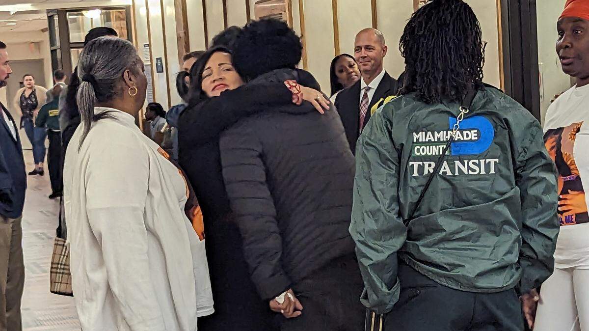 Clayton Dillard Sr., whose son Clayton Dillard was killed outside El Mula banquet hall two years ago during a mass shooting, is surrounded by family and friends after the verdict. He’s seen here hugging a Miami-Dade victim’s advocate.