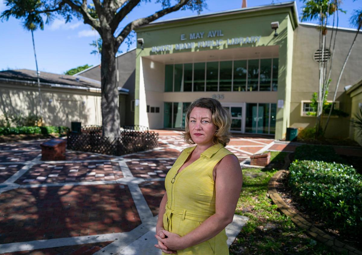 Laura Hill, a candidate in last year’s North Miami municipal election, stands outside the North Miami Public Library on Feb. 2, 2022. Hill is blowing the whistle on potential abuse of voter assistance that allows city employees and campaign workers to enter the polls with voters.