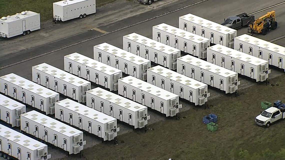 Aerial footage of rows of trailers during the new immigration center’s construction. The structures appear to be possible bathroom facilities.