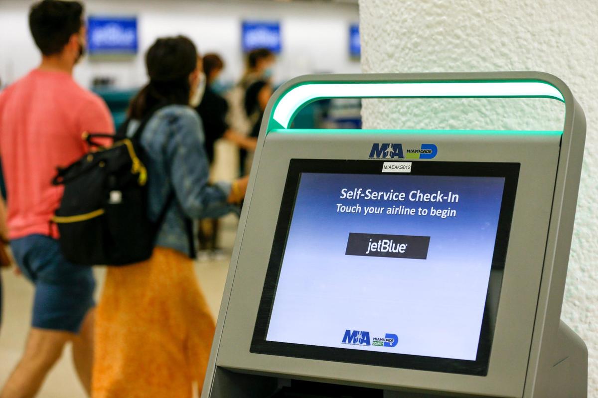 A self-service check-in kiosk for travelers flying with JetBlue is shown inside Concourse E at Miami International Airport on Friday, August 6, 2021.