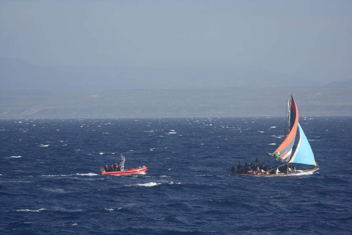 The U.S. Coast Guard approaches a boat the agency said was ferrying 189 Haitians.