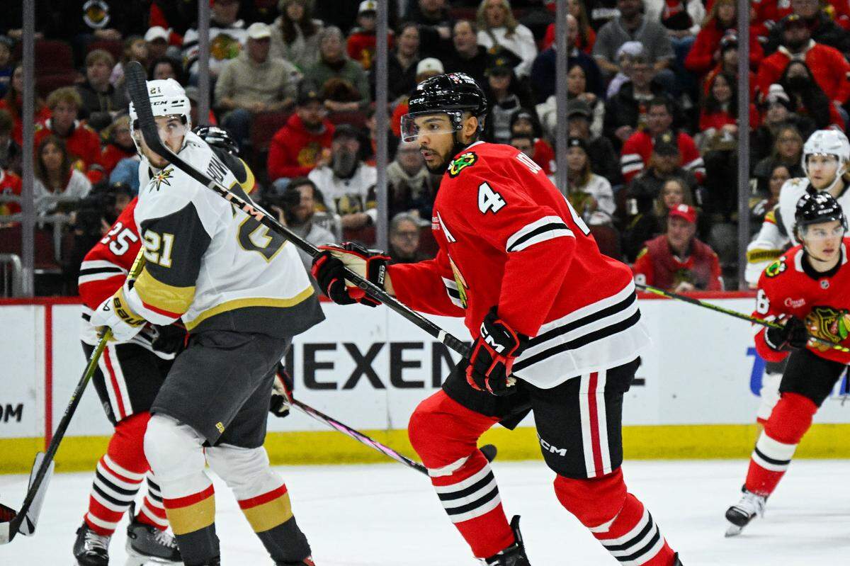 Jan 18, 2025; Chicago, Illinois, USA; Chicago Blackhawks defenseman Seth Jones (4) skates against the Vegas Golden Knights during the first period at United Center. Mandatory Credit: Matt Marton-Imagn Images