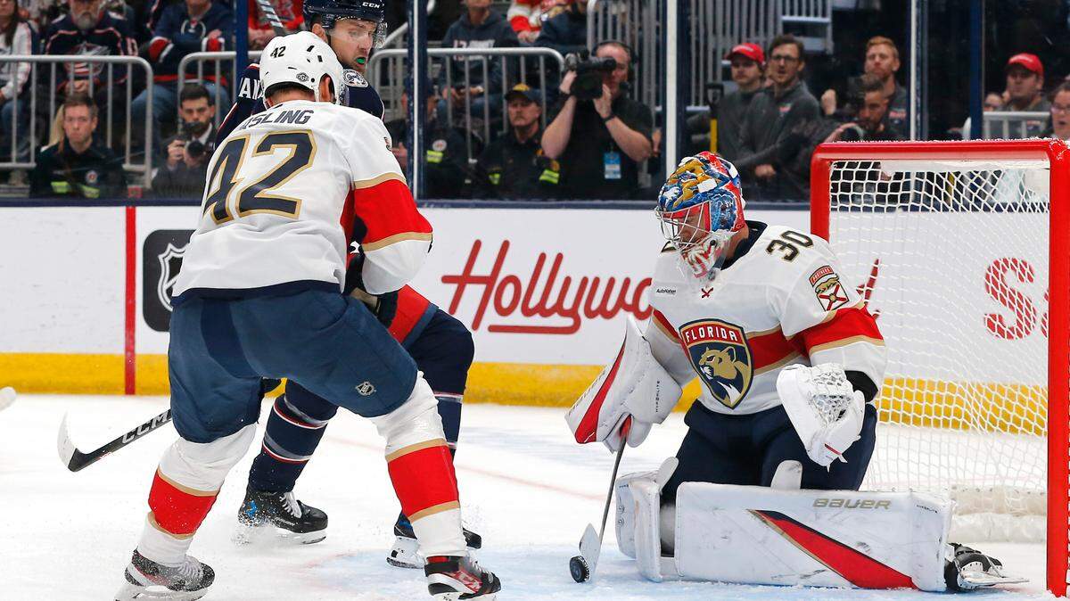 Oct 15, 2024; Columbus, Ohio, USA; Florida Panthers goalie Spencer Knight (30) makes a save on the tip from Columbus Blue Jackets left wing James van Riemsdyk (21) during the second period at Nationwide Arena. Mandatory Credit: Russell LaBounty-Imagn Images