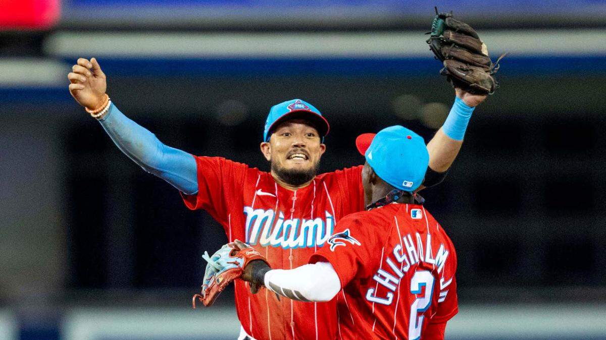 Miami Marlins shortstop Miguel Rojas (19) and second baseman Jazz Chisholm (2) react to defeating the Philadelphia Phillies 3-2 during an MLB game at loanDepot park in the Little Havana neighborhood of Miami, Florida, on Saturday, September 4, 2021