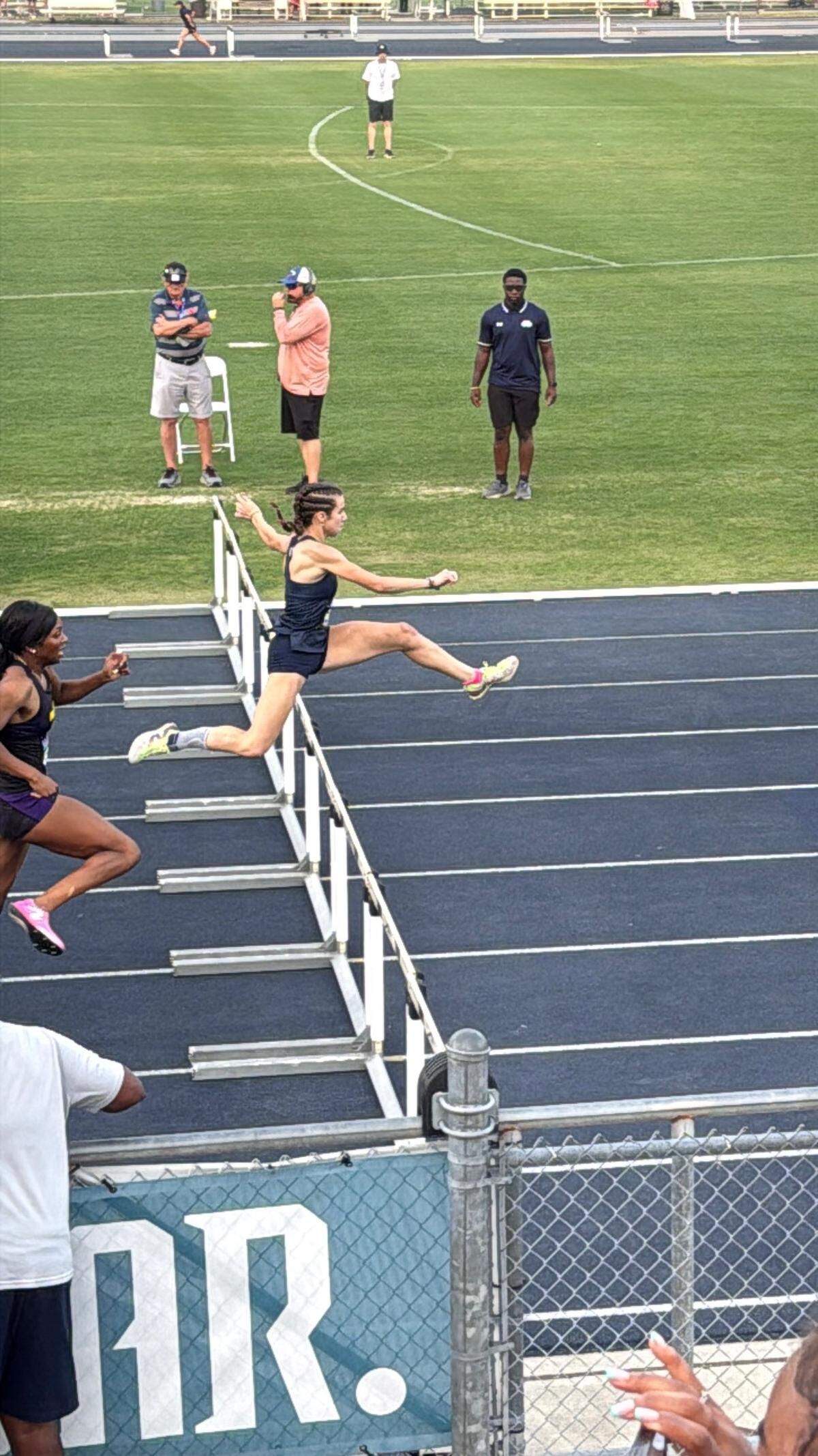 Carrollton’s Arianna Garcia leaps the final hurdle on her way to the state championship at the Class 2A state track meet in Jacksonville, Fla.