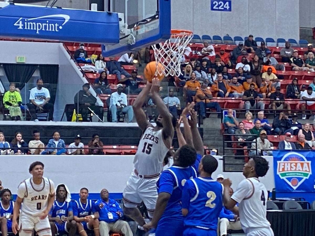 Mater Lakes’ Christian Reid battles in the paint during Thursday’s Class 4A state boys’ basketball semifinal win over St. Petersburg Gibbs at the RP Funding Center in Lakeland, Fla.