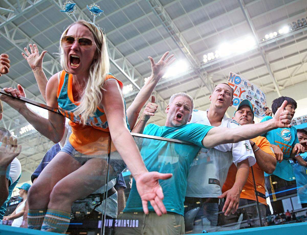 Miami Dolphins fans cheer as the team defeats the Philadelphia Eagles at Hard Rock Stadium in Miami Gardens, Florida, Sunday, December, 1, 2019.