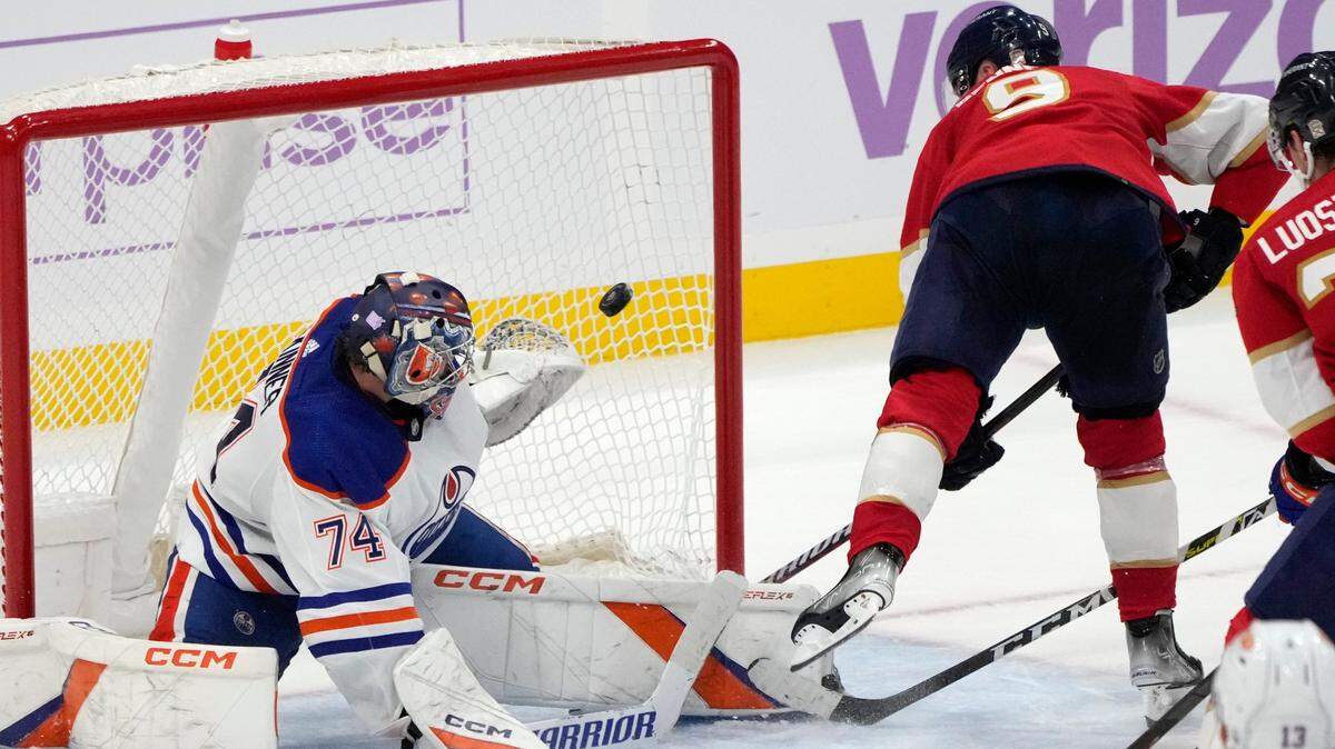 Florida Panthers center Sam Bennett (9) shoots a goal against Edmonton Oilers goaltender Stuart Skinner (74) during the third period of an NHL hockey game, Saturday, Nov. 12, 2022, in Sunrise, Fla. (AP Photo/Lynne Sladky)
