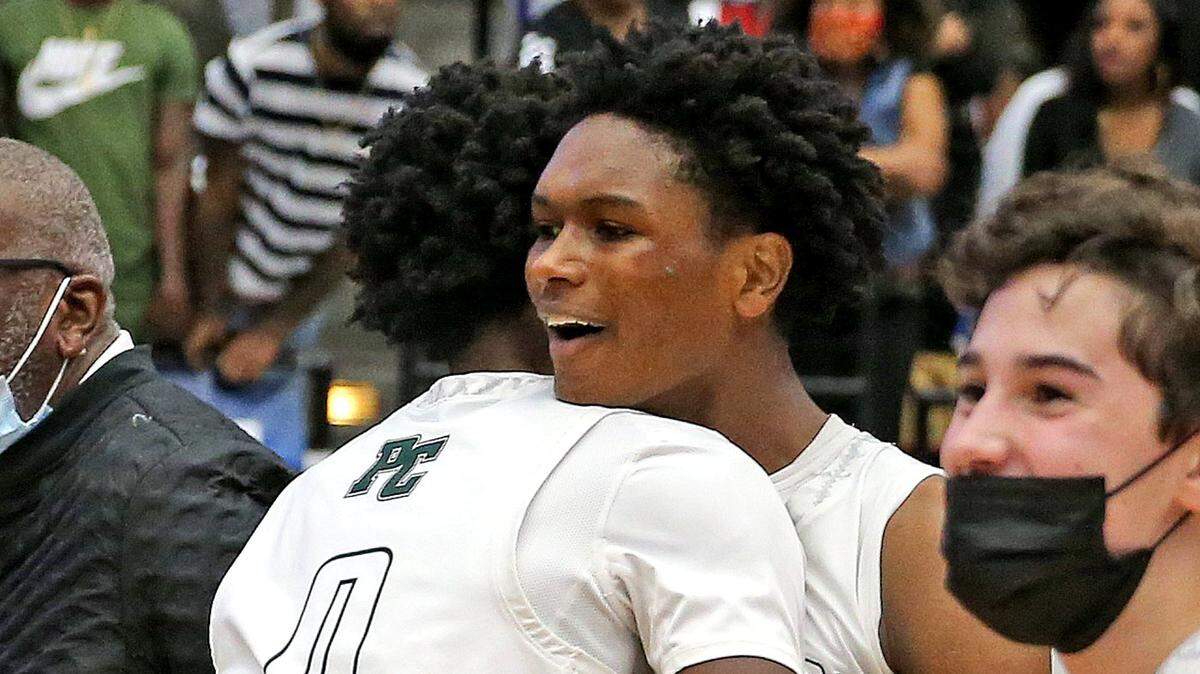 Pinecrest brothers Ausar Thompson (0) and Amen Thompson (1) celebrate after defeating Santa Fe in the FHSAA 4A Boys’ Basketball Finals in Lakeland, Florida, Saturday, March 6, 2021.