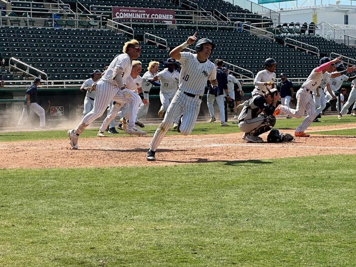 North Broward Prep players celebrate after Branden Hoch scores the winning run in a 5-4 comeback win over Gulliver Prep in a Class 3A state baseball semifinal at Hammond Stadium in Fort Myers.