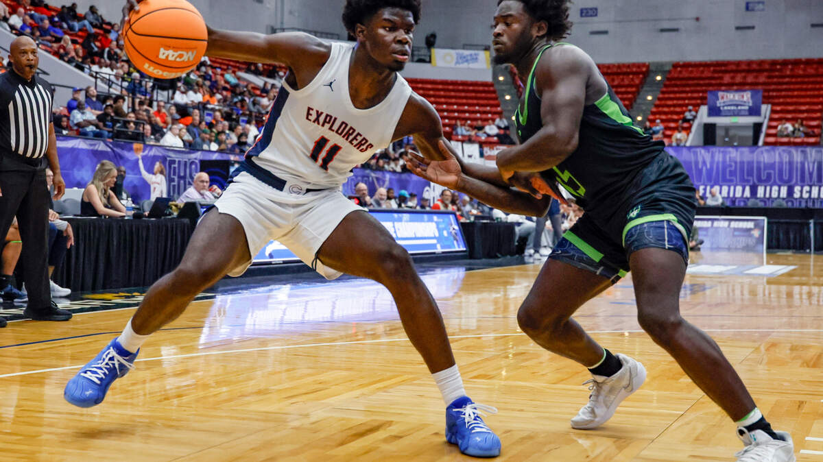 Columbus High School’s Caleb Gaskins (11) drives the ball as Windermere’s Korvantae Hatter(15) defends in the first half of the FHSAA Class 7A Final for Boys High School Basketball State Championship at the RP Funding Center in Lakeland, Florida on Saturday, March 8, 2025. 

