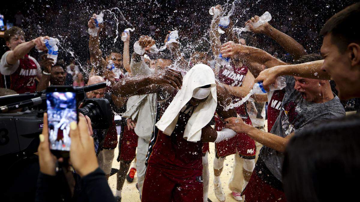Miami Heat center Bam Adebayo (13) gets water poured on him by his teammates after he scored 83 points against the Washington Wizards, marking the second-highest single-game point total in NBA history, on Tuesday, March 10, 2026, at Kaseya Center in downtown Miami, Fla. The Miami Heat won 150-129.