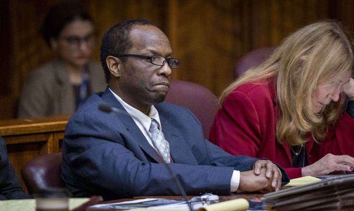 Miami, FL, November 5, 2025 - Labrant Dennis, left, reacts as he listens to the prosecution's closing arguments for his retrial for murder. Labrant Dennis was convicted in 1998 of killing Timwanika Lumpkins, his ex-girlfriend, and UM linebacker Marlin Barnes. Jurors will decide if he should be sent back to death row.