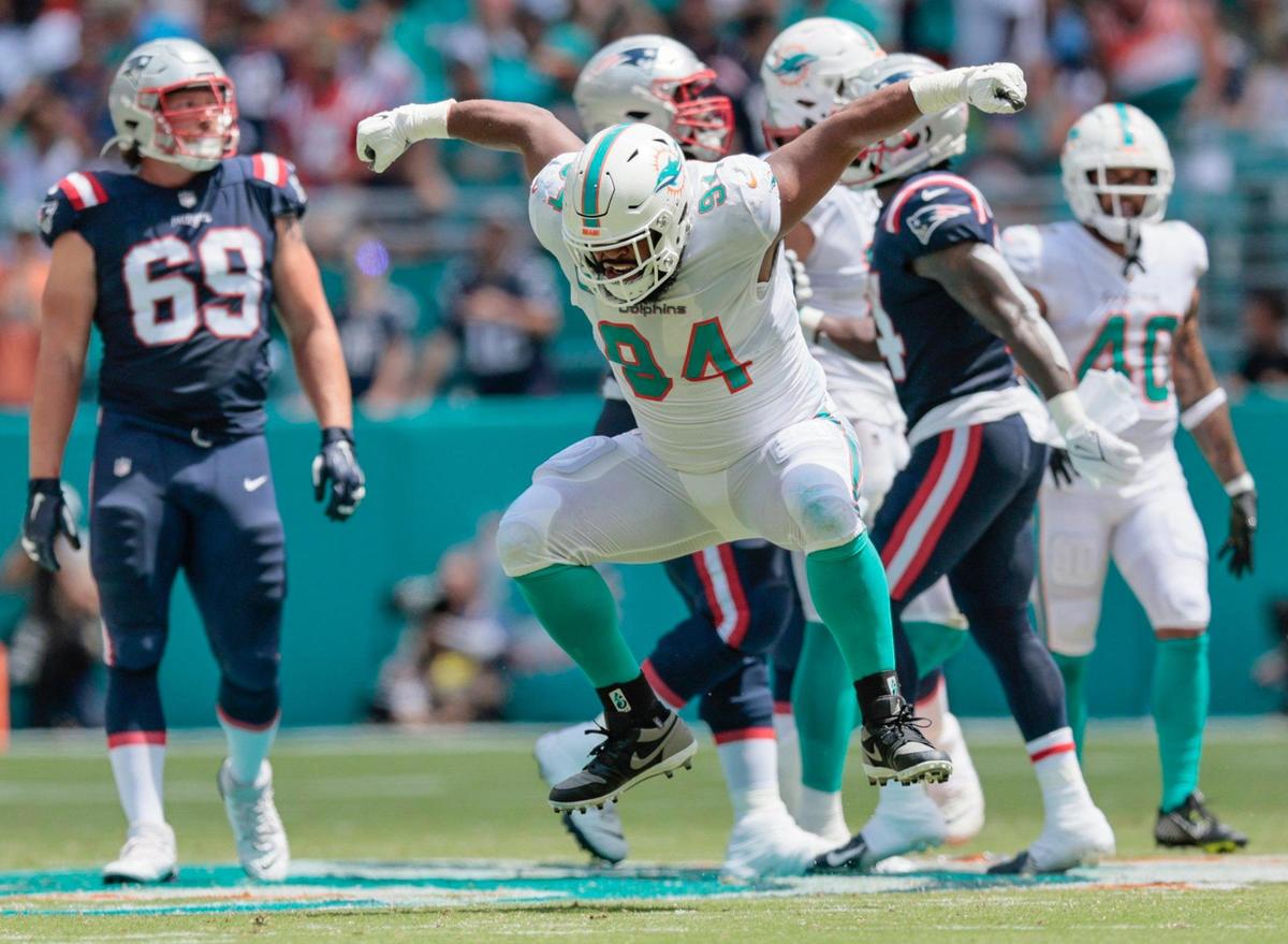 Miami Dolphins defensive tackle Christian Wilkins (94) reacts after taking down New England Patriots wide receiver Ty Montgomery (14) in the first quarter at Hard Rock Stadium in Miami Gardens on Sunday, September 11, 2022.