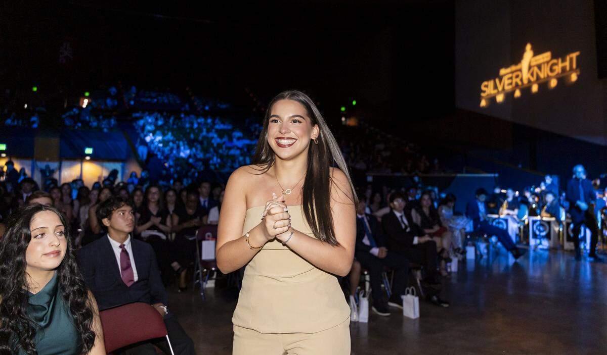Silver Knight winner Zoey Trillas, from Hialeah Gardens Senior High, walks to the stage after winning in the Speech category.