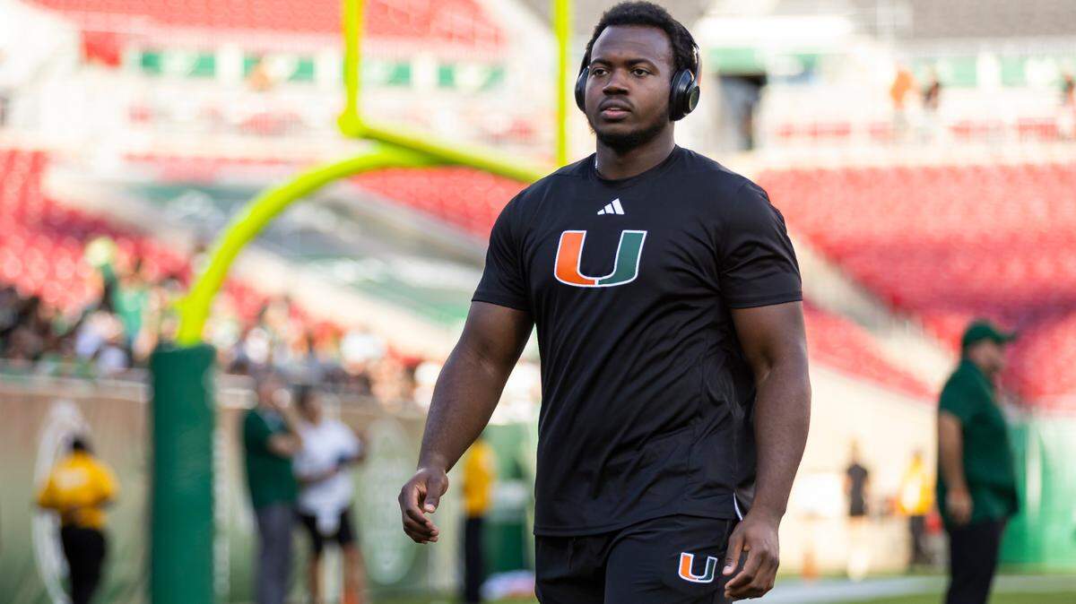 Miami Hurricanes defensive lineman Rueben Bain Jr. (4) walks off the field before the start of his NCAA college football game against the South Florida Bulls at the Raymond James Stadium on Saturday, Sept. 21, 2024, in Tampa, Fla.