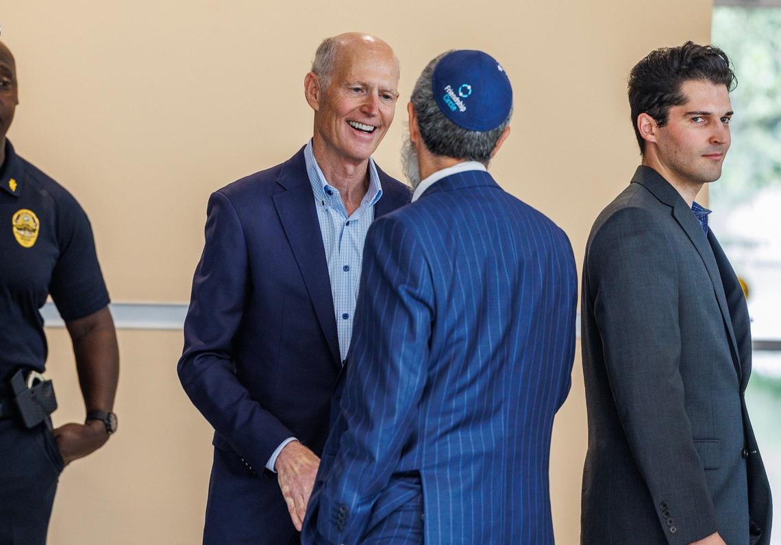 Florida U.S. Senator Rick Scott (left) talks to Rabbi Yossi Harlig, of the Chabad of Kendall as he arrives for the Floridians Against Anti-Semitism roundtable event at Florida International University, in Miami, on Friday September 20, 2024.