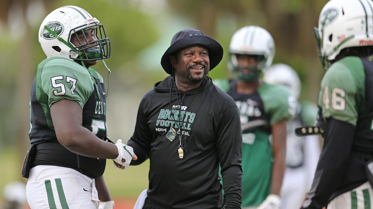Miami Central Senior High School football  head coach Roland Smith talks with players at practice on Tuesday, Oct. 9, 2018.