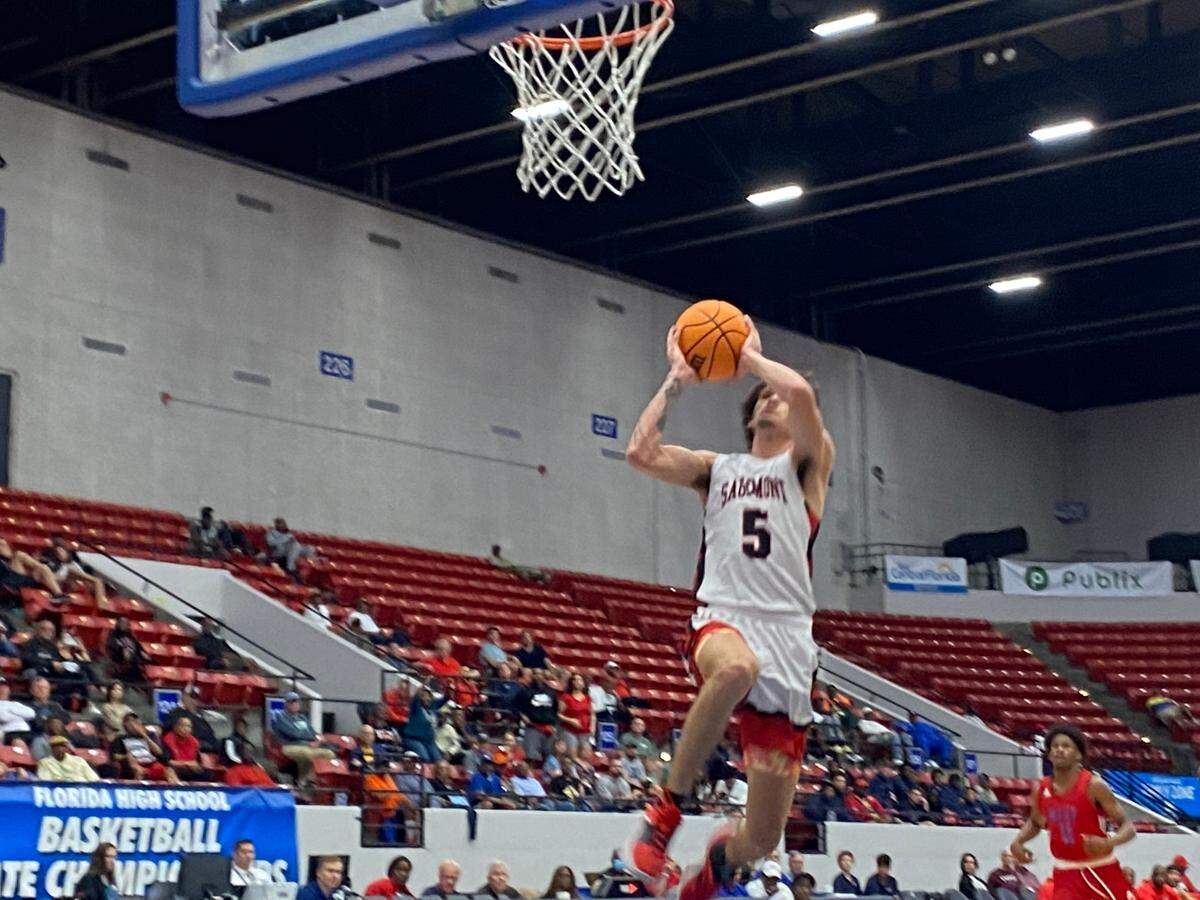 Sagemont guard Tynan Becker breaks away for a dunk against Jacksonville North Florida Educational Institute during Wednesday afternoon’s boys’ basketball Class 2A state semifinal at the RP Funding Center in Lakeland, Fla.