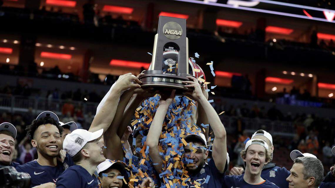In this March 30, 2019, file photo, members of Virginia celebrate after defeating Purdue 80-75 in overtime of the men’s NCAA Tournament college basketball South Regional final game in Louisville, Ky. An Associated Press analysis of rosters of perennial NCAA Tournament teams concludes it takes NBA-caliber talent to go far consistently. And though this year’s Final Four is being touted as one in which experience and teamwork won out over raw talent, three of the teams in Minneapolis, including Virginia, possess that young NBA talent.