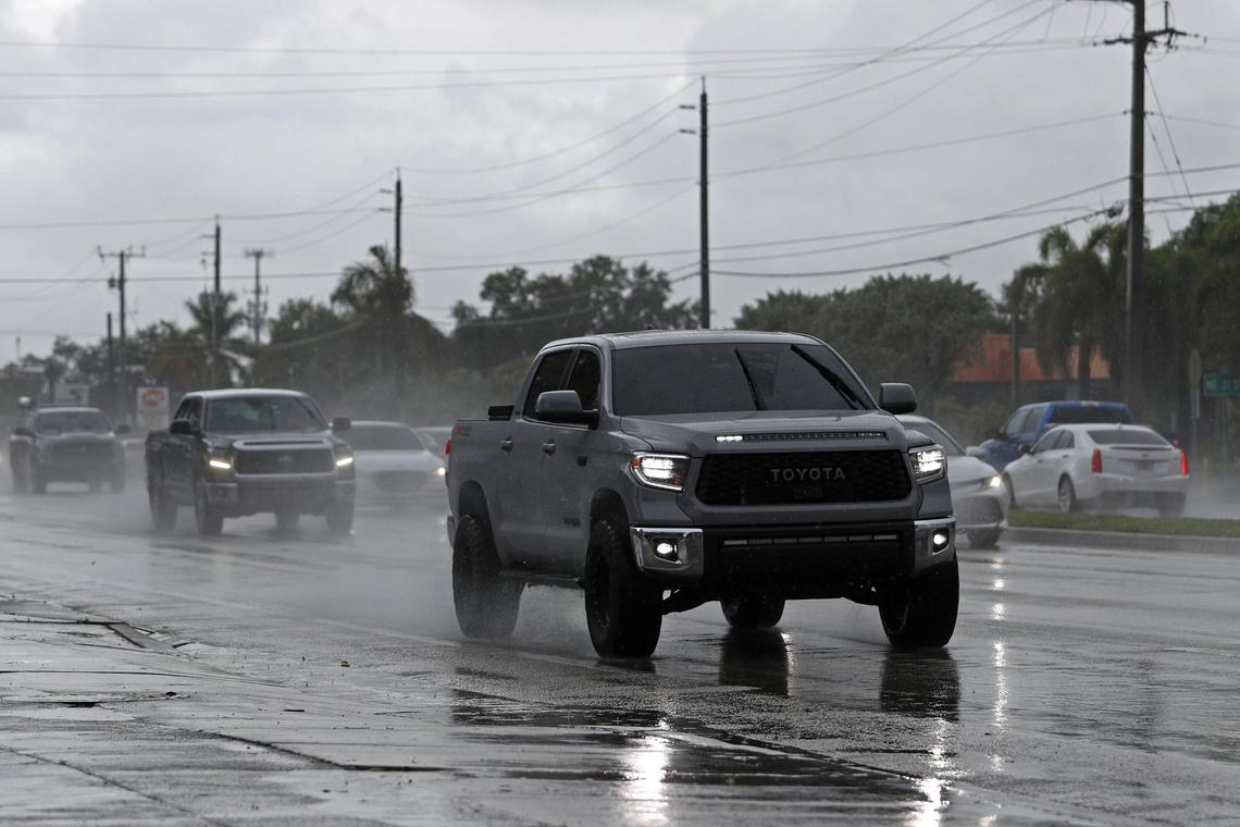 Cars drive in the rain as stormy weather passes through Lighthouse Point on Friday, May 20, 2022.