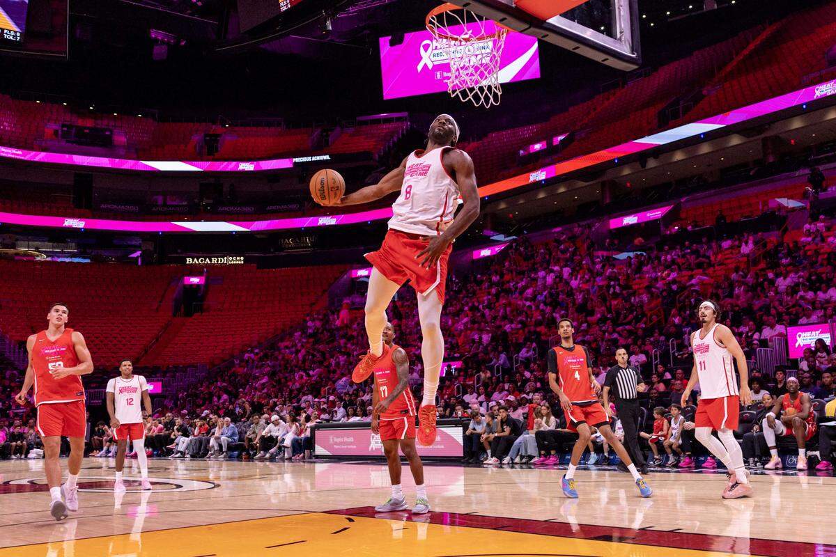 Miami Heat center Precious Achiuwa dunks the ball during the annual Red, White and Pink intrasquad Heat scrimmage at Kaseya Center on October 15, 2025, in Miami.
