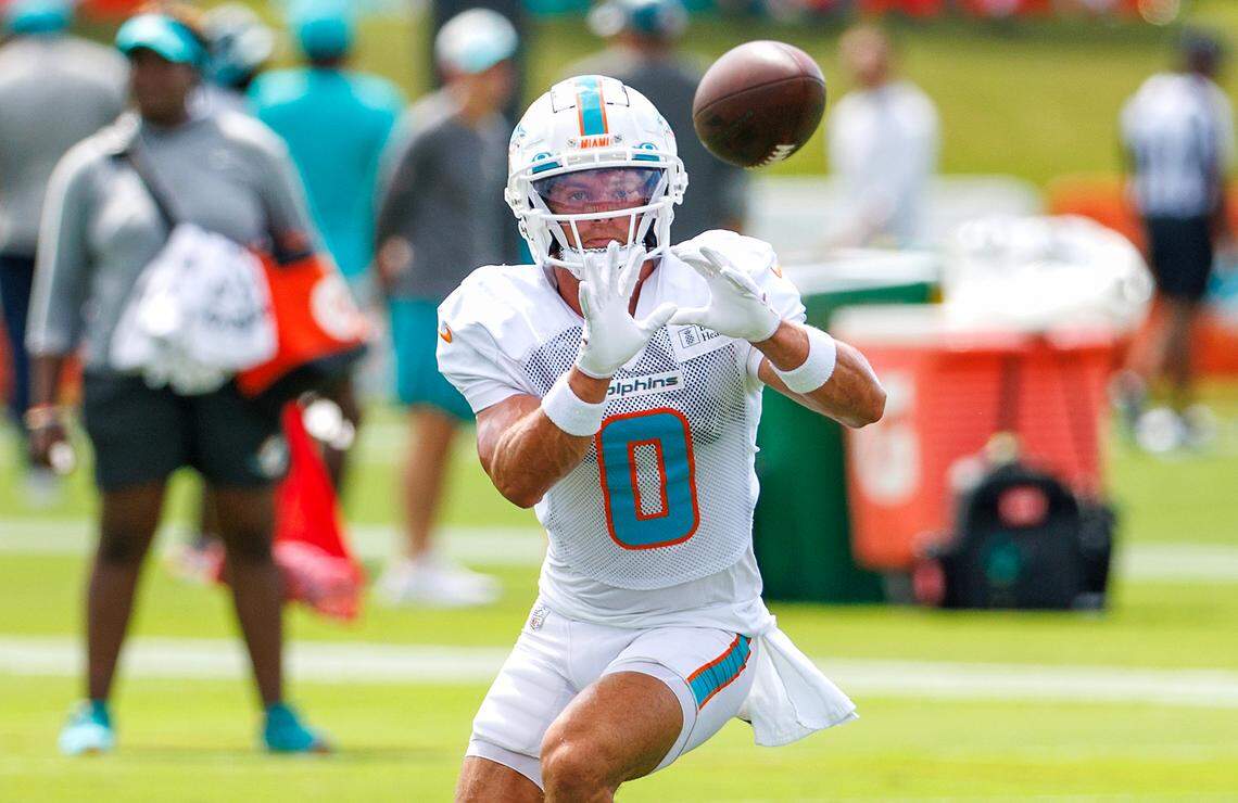 Miami Dolphins wide receiver Braxton Berrios (0) catches a pass during NFL football training camp at Baptist Health Training Complex in Hard Rock Stadium on Thursday, August 3, 2023 in Miami Gardens, Florida.