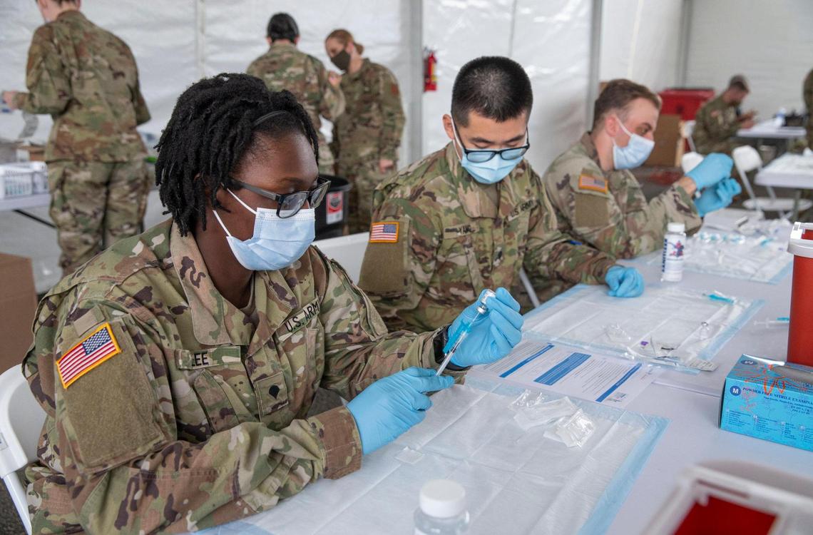 Taeja Lee, 22, prepares a vaccine at the new FEMA site at Miami Dade College’s North Campus, on March 3, 2021.