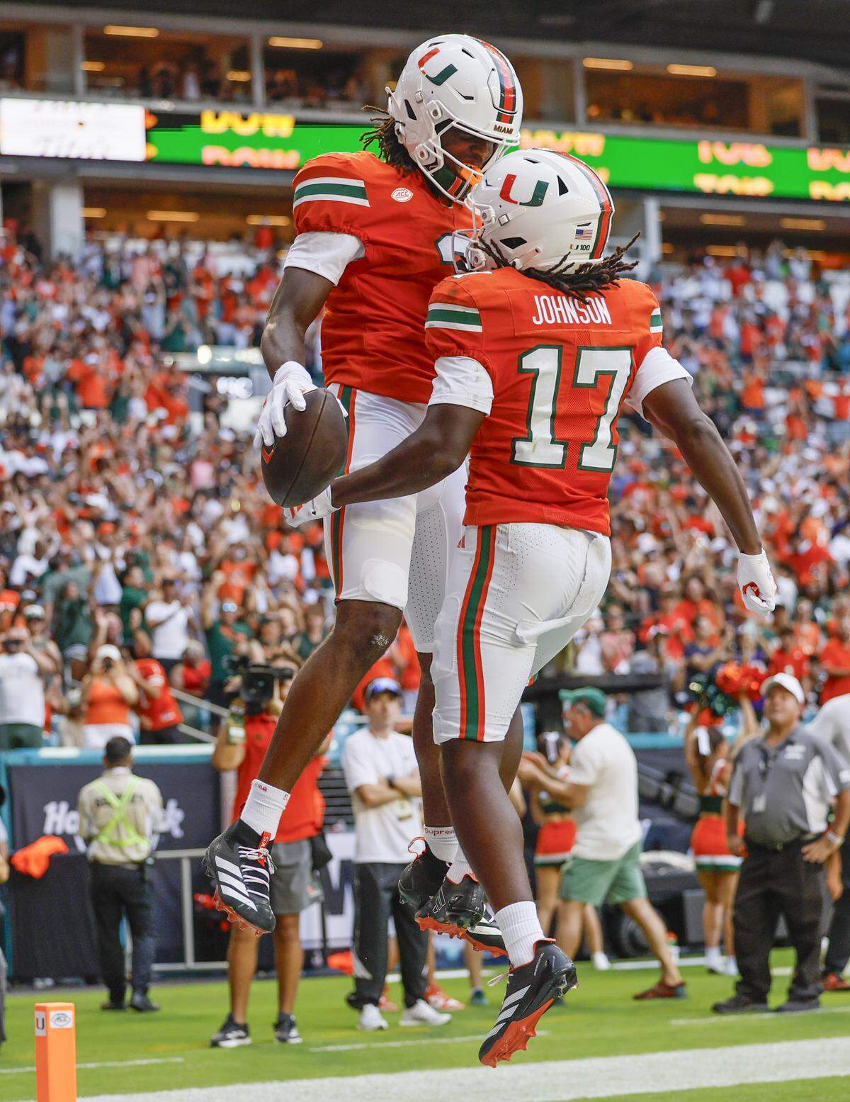 Miami Hurricanes wide receiver Joshua Moore (3) celebrates his touchdown with wide receiver Tony Johnson (17) in the endzone after Moore scores in the first half of their NCAA football game against the South Florida Bulls at Hard Rock Stadium in Miami Gardens, Florida, on Saturday, September 13, 2025.