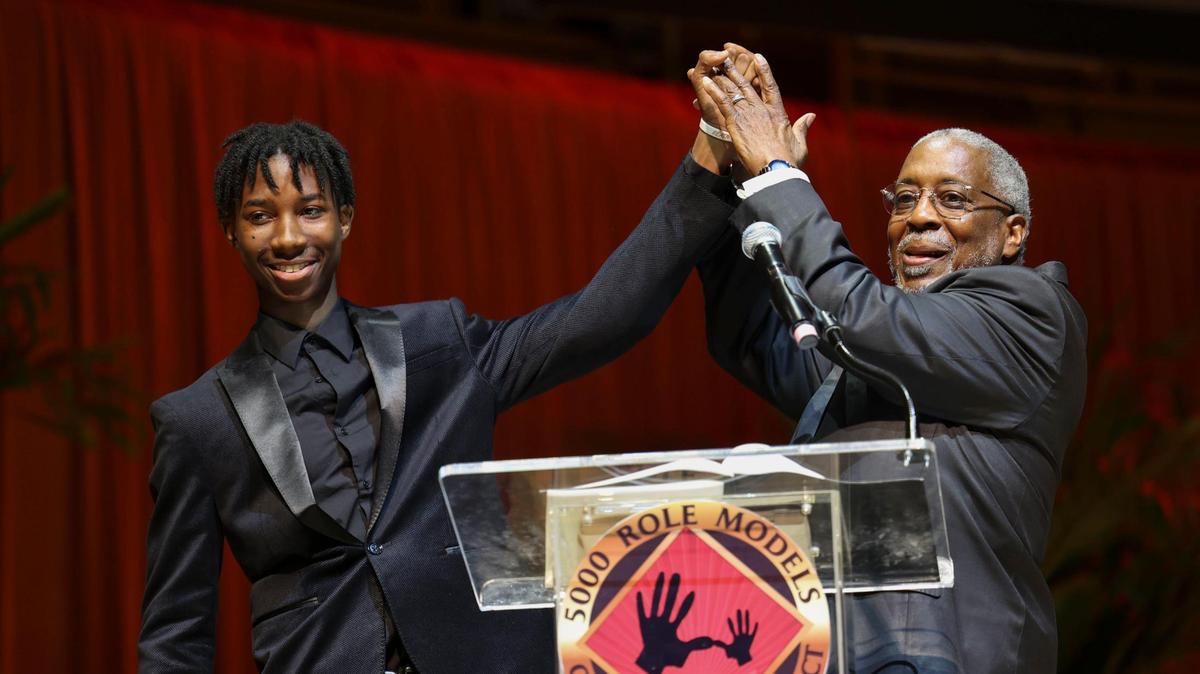Terrain Small, left, a Freedom Writer at Miami Norland Senior High School, gets praise for his performance of a spoken word poem he wrote called “Hoodlum’s Deception” during the scholarship ceremony for the Wilson Scholars of the 5000 Role Models of Excellence Program on Sunday, June 5, 2022, at the Adrienne Arsht Center in downtown Miami.
