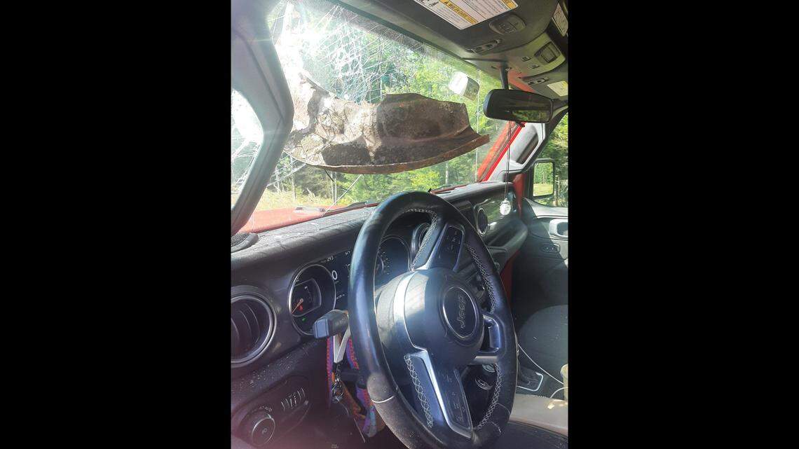 Metal debris in Jeep windshield.