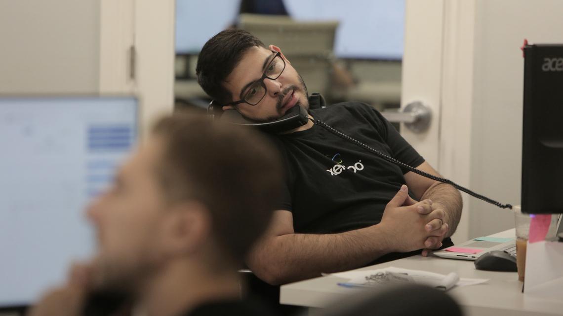 Fort Lauderdale, FL, June 26, 2019 - Anthony McHugh, Onboard specialist for xendoo speaks to a client during office hours. Xendoo, is an online accounting and bookkeeping company located at 5300 Powerline Road, Ft. Lauderdale, Florida