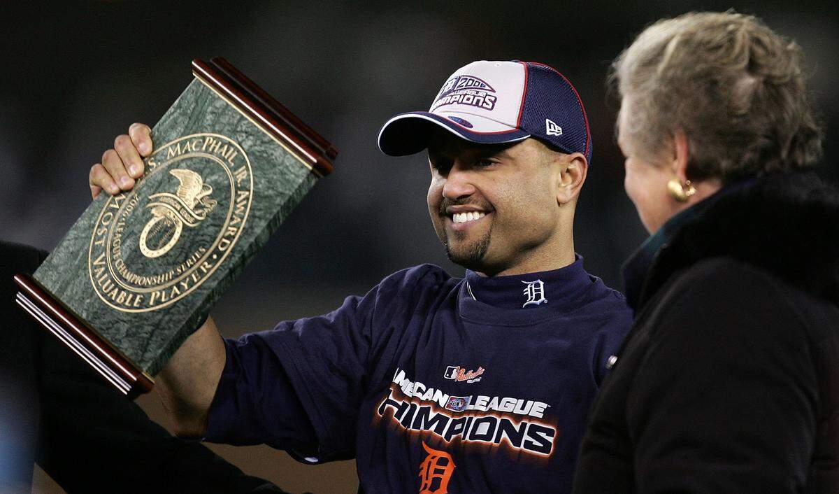 DETROIT - OCTOBER 14: AL Playoff MVP Placido Polanco #14 of the Detroit Tigers holds the MVP trophy after the TIgers won 6-3 against the Oakland Athletics during Game Four of the American League Championship Series October 14, 2006 at Comerica Park in Detroit, Michigan. With the win the Tigers advanced to the World Series. (Photo by Jonathan Daniel/Getty Images)