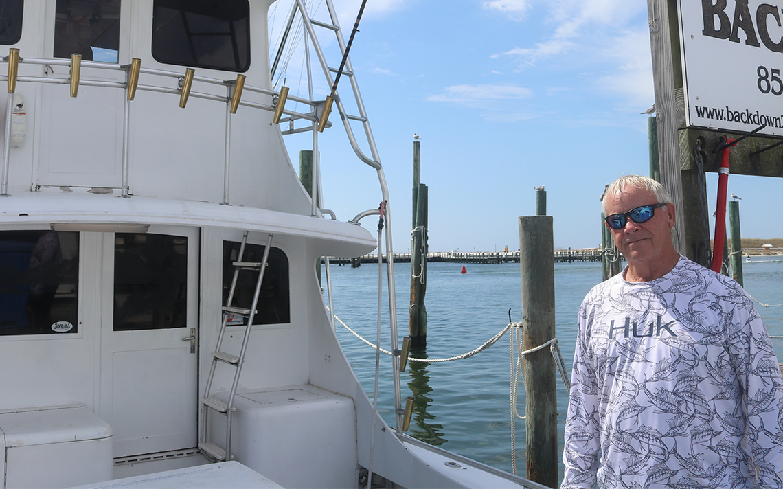 Gary Jarvis poses in front of his boat “The Backdown 2” on Thursday, Oct. 9. 2025. As one of the only boats with a satellite phone during the Deepwater Horizon spill, Jarvis frequently reported what he witnessed in the Gulf to then-Gov. Charlie Crist.